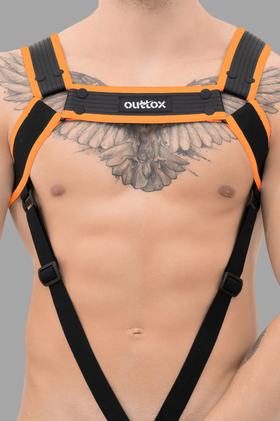 Outtox. Harnais de corps avec boutons-pression. Noir et orange