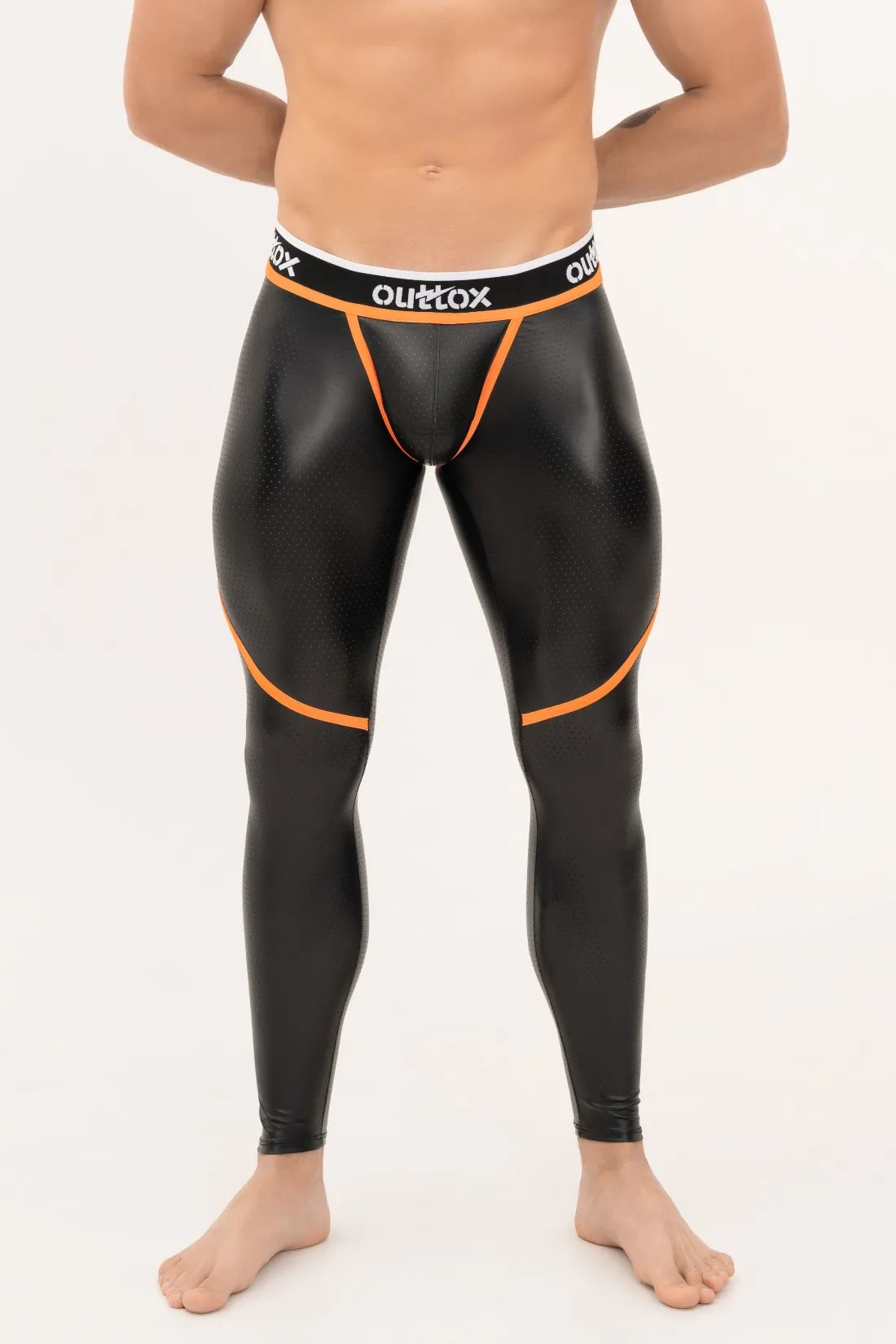 Outtox. Legging met rits aan de achterkant en drukknoopsluiting. Zwart+oranje