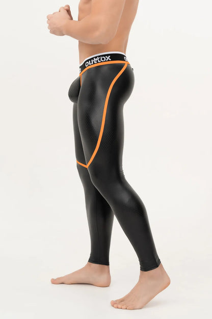 Outtox. Leggings mit Reißverschluss hinten und Druckknopf-Codpiece. Schwarz und Orange