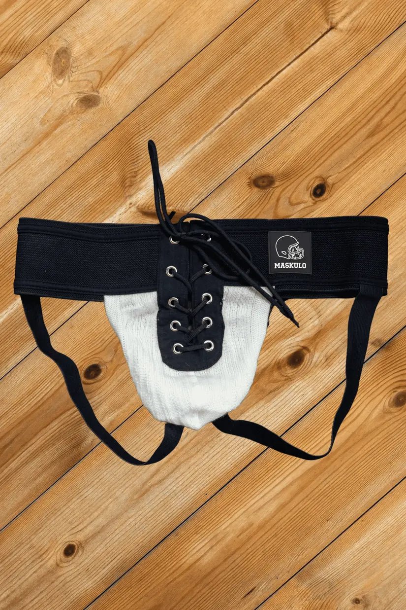 Ken Gridd Iron American Football Jockstrap by Maskulo in black and white. Comfortable and durable athletic support accessory.
